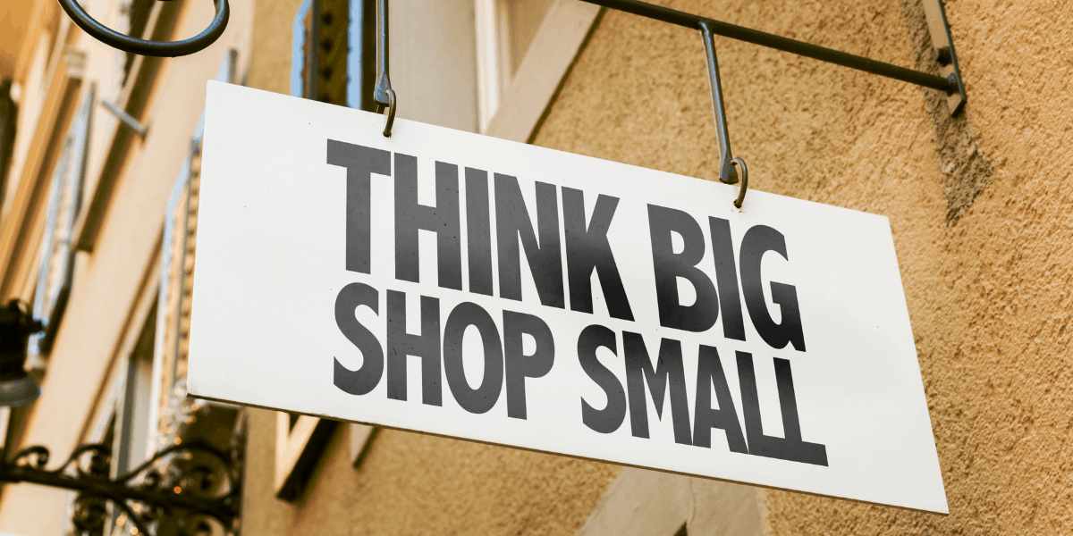 think big shop small marketing boutique marketing firm agency signage outside wall hanging